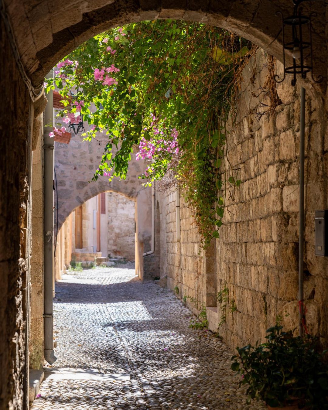 A stone archway and cobbled lane in the Medieval City of Rhodes