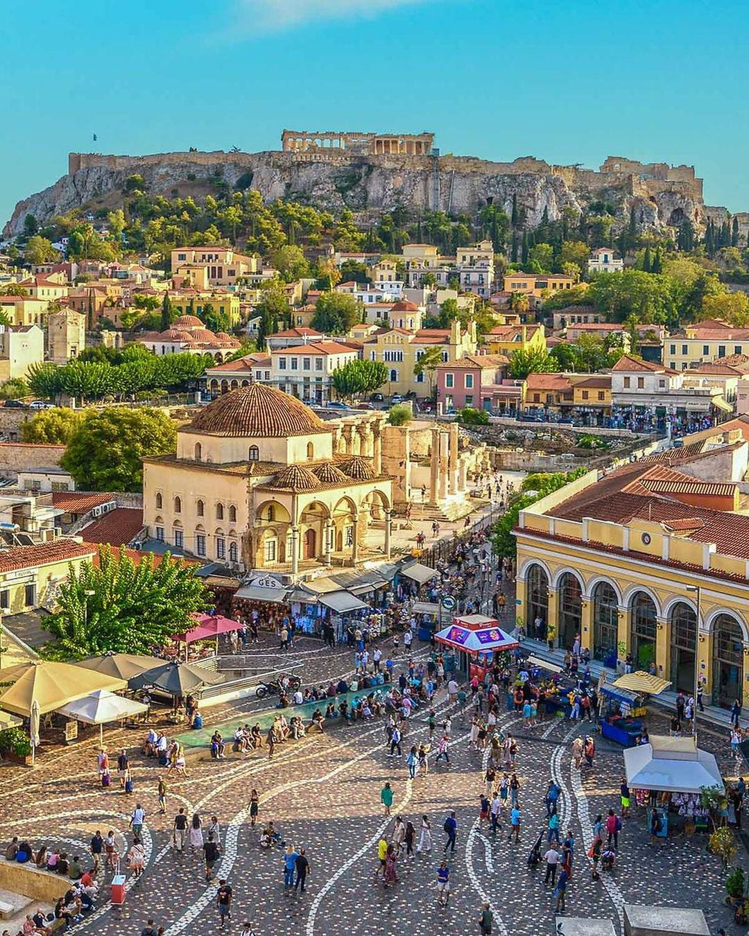 The Acropolis above the rooftops and square of Monastiraki in Athens
