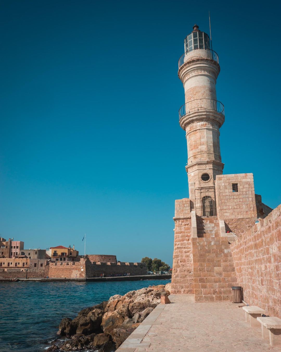 The stone lighthouse at the entrance of the Venetian Harbor of Chania