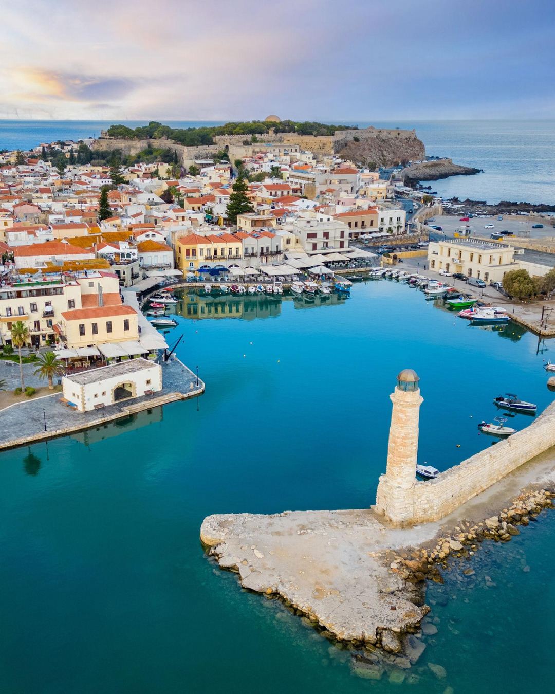 A Venetian harbor and lighthouse in a Cretan old town