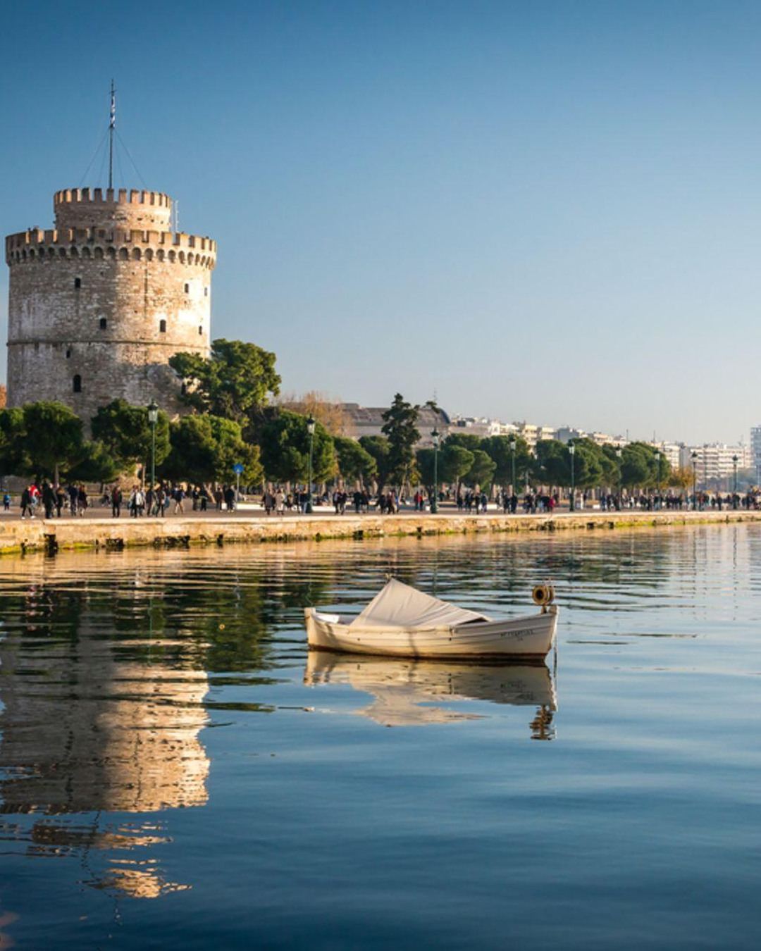 The White Tower and calm waterfront of Thessaloniki at golden hour
